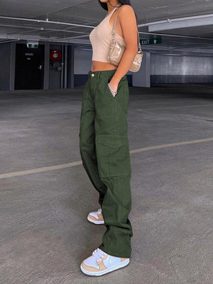 a woman standing in an empty parking garage