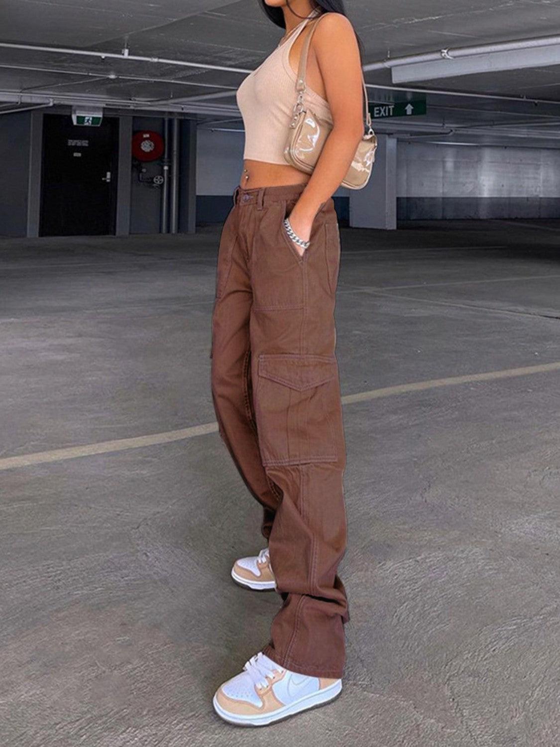 a woman standing in an empty parking garage