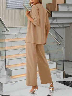 a woman standing in front of a stair case