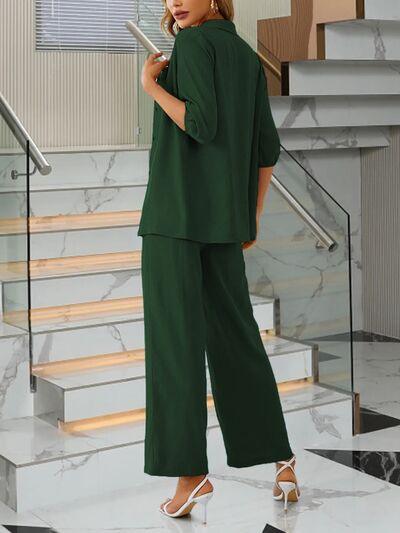 a woman in a green outfit standing on a staircase