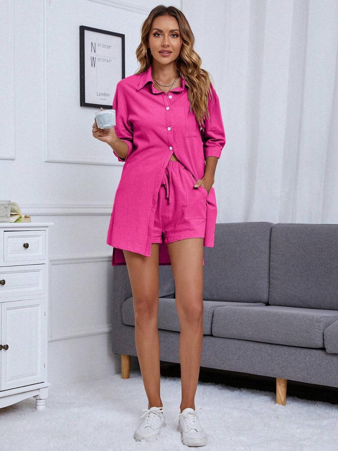 a woman in a pink shirt dress holding a cup