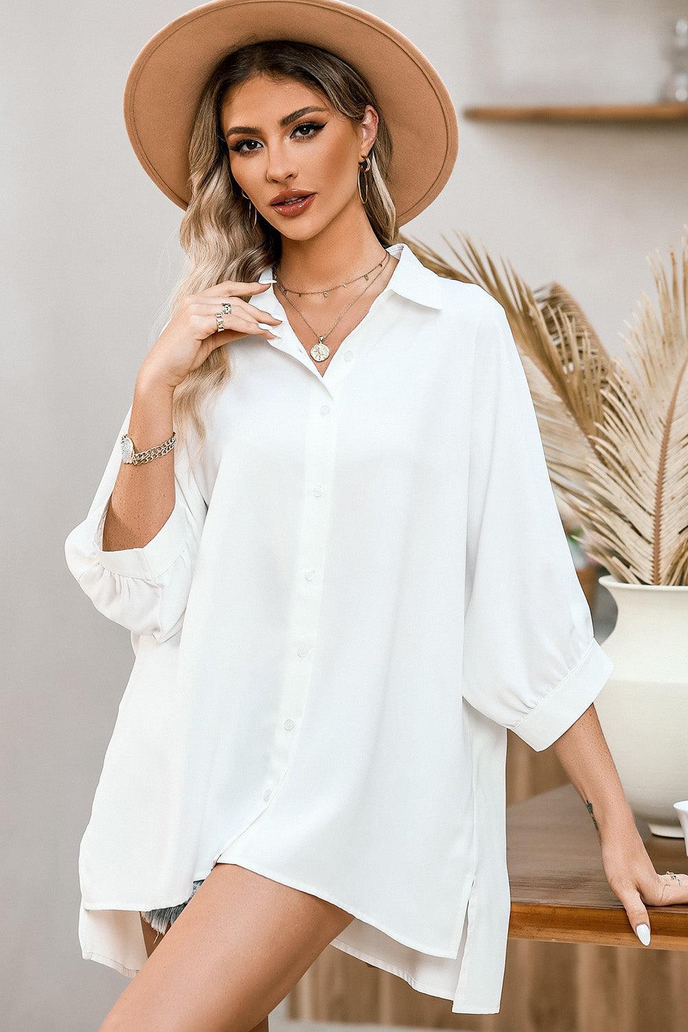 a woman wearing a hat and a white shirt