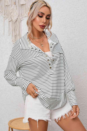a woman wearing a black and white striped shirt