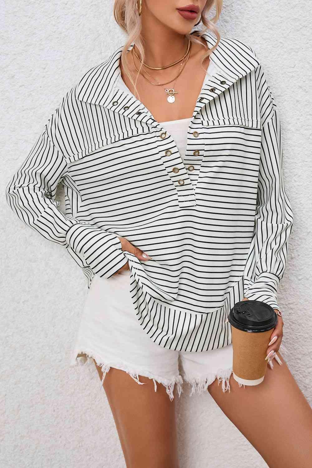 a woman wearing a black and white striped shirt