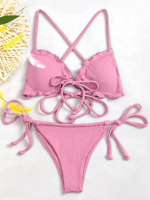 a pink bikini top with a tie around the bottom