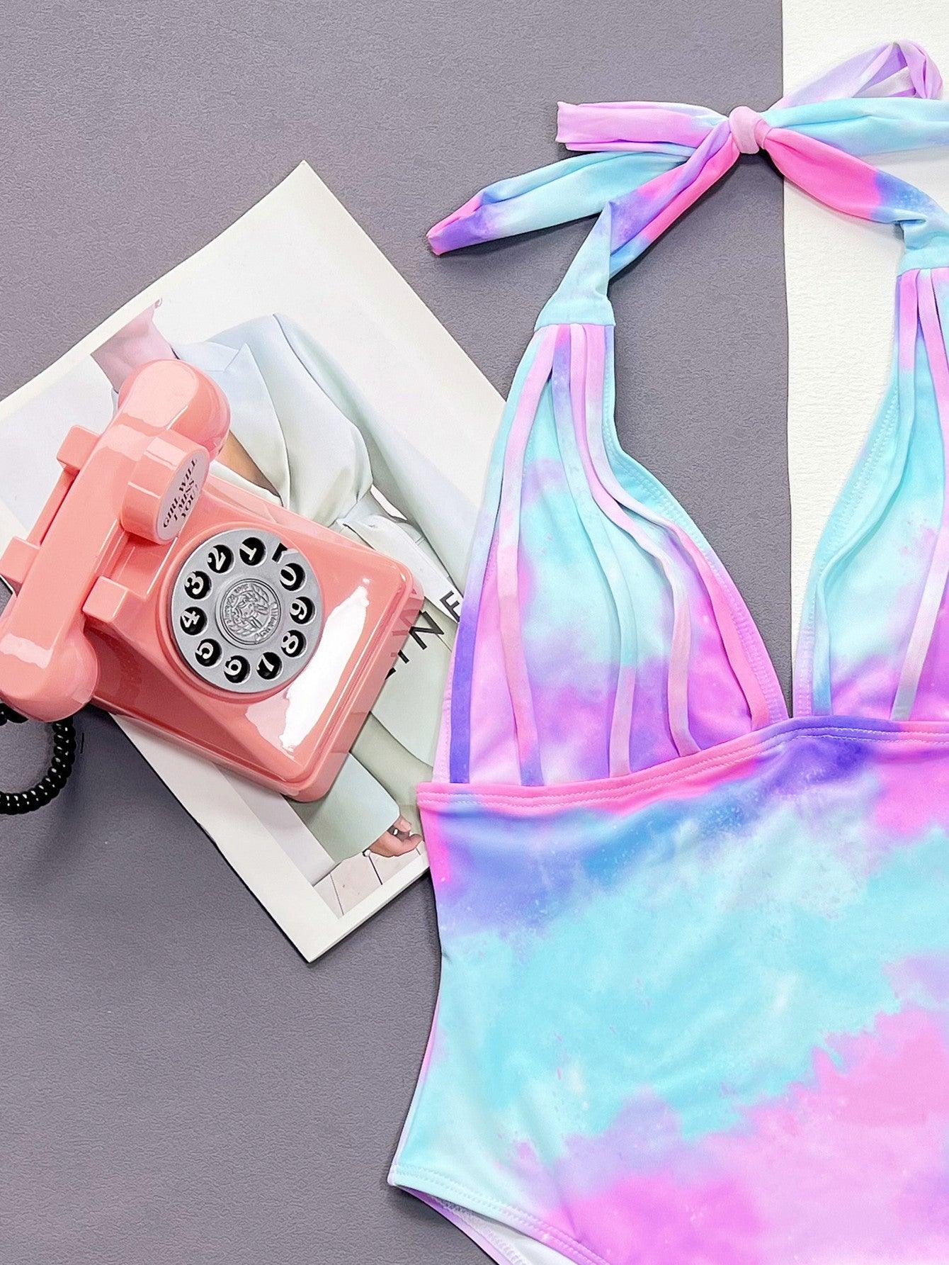 a tie dye swimsuit with a phone on the phone