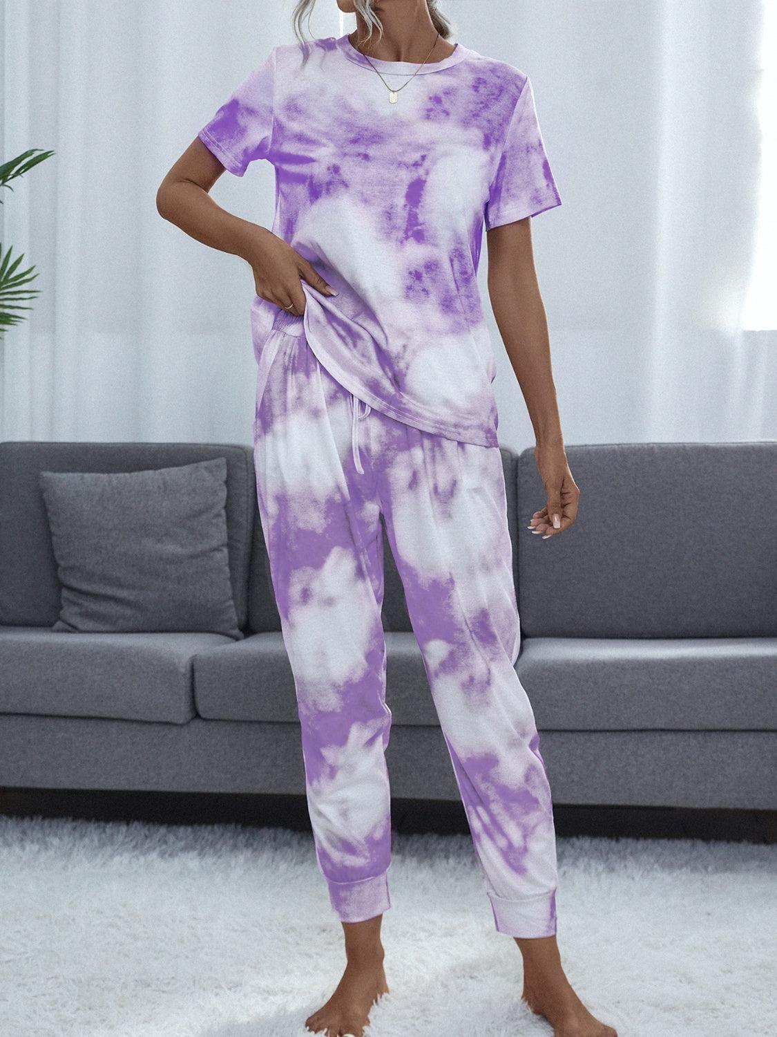 a woman in a purple and white tie dye outfit