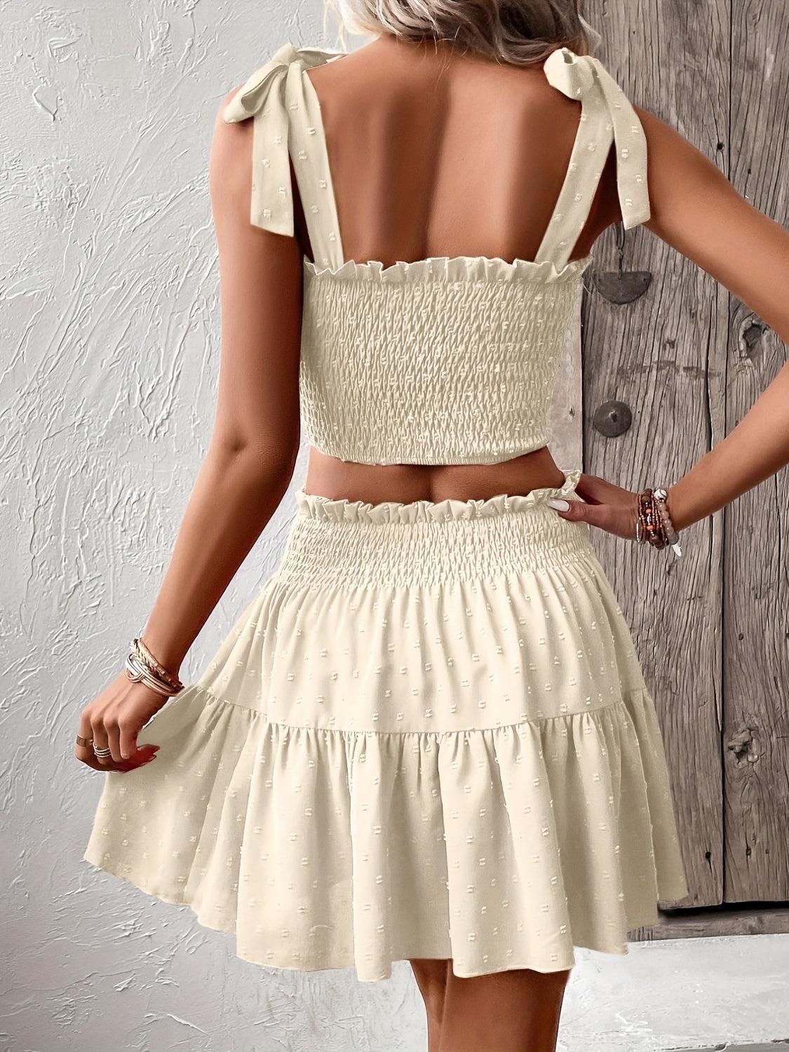 the back of a woman wearing a white dress