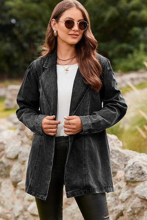 a woman wearing black leather pants and a denim jacket