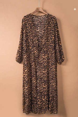 a leopard print dress hanging on a hanger