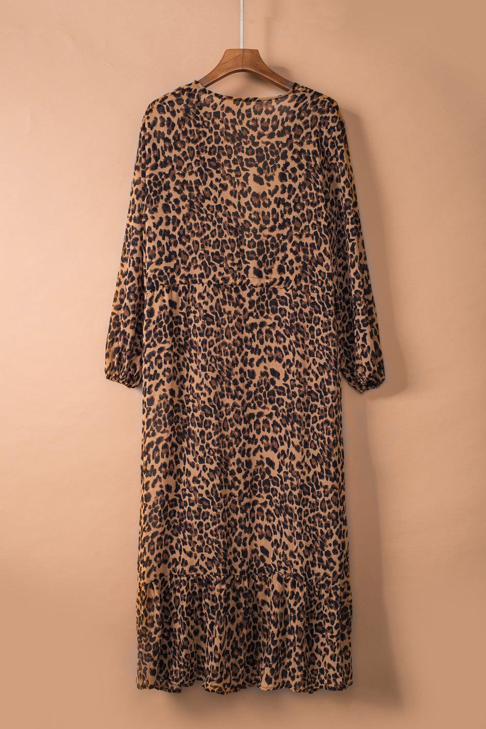 a leopard print dress hanging on a hanger