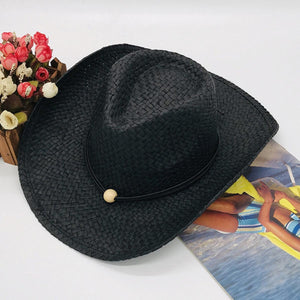 a black hat sitting on top of a table