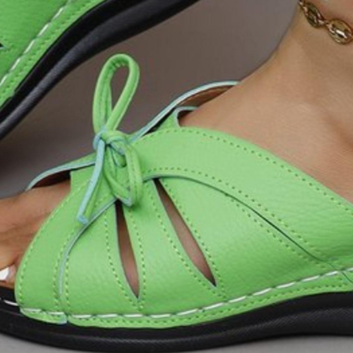 a close up of a person wearing green shoes