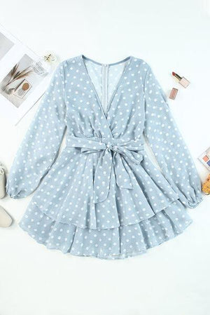 a blue polka dot dress with white polka dots on it