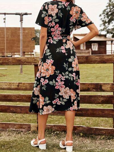 a woman standing in front of a fence