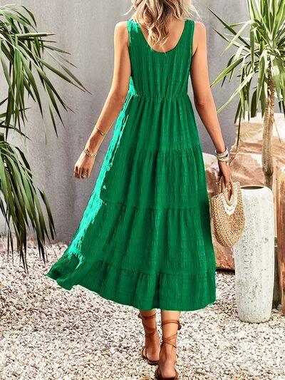 a woman in a green dress is walking