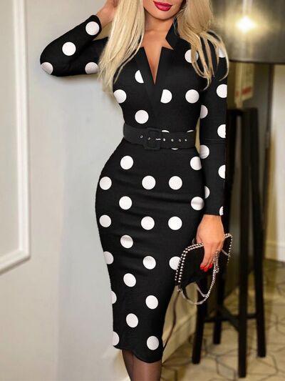 a woman in a black and white polka dot dress