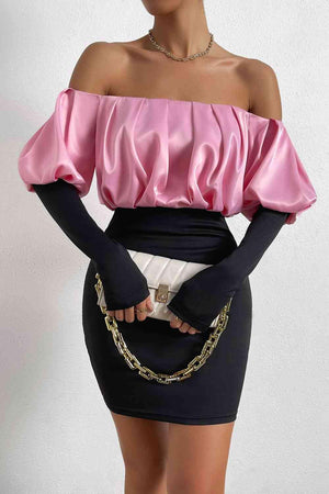 a woman wearing a pink top and black skirt