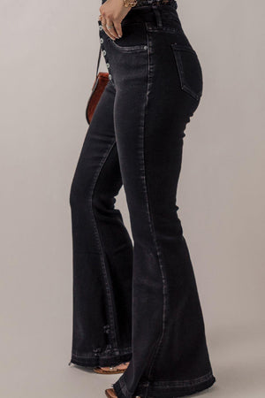 a woman wearing a pair of black jeans