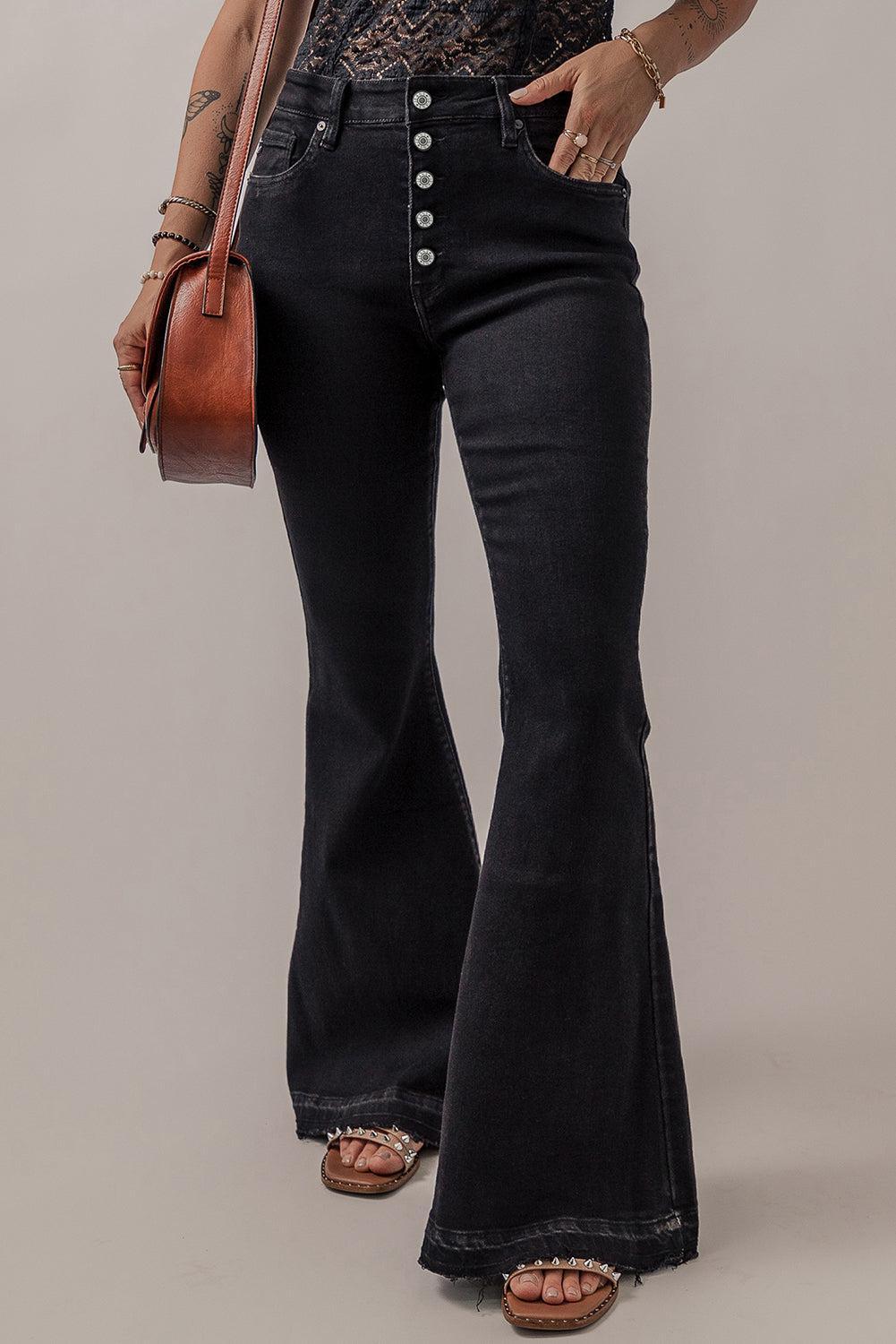 a woman in a black top and black jeans