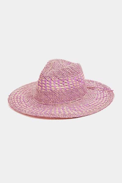 a pink straw hat on a white background
