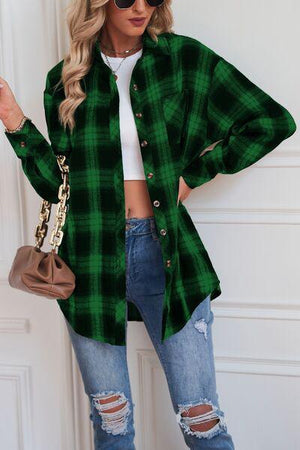 a woman wearing a green plaid shirt and ripped jeans