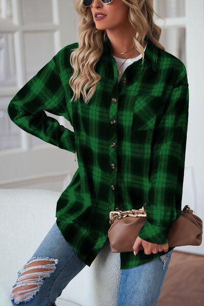 a woman wearing a green and black plaid shirt