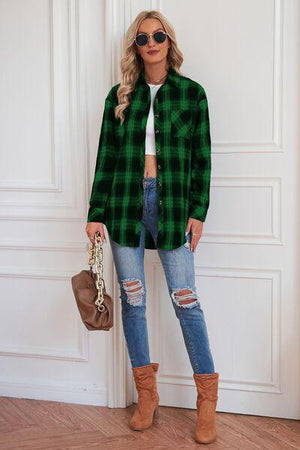 a woman standing in front of a door wearing a green plaid shirt