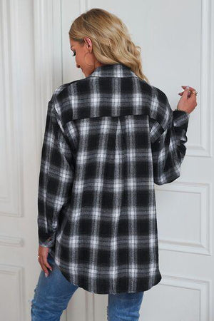 a woman wearing a black and white plaid shirt