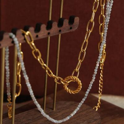 a close up of a wooden stand with chains on it