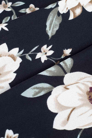 a close up of a black and white flowered fabric