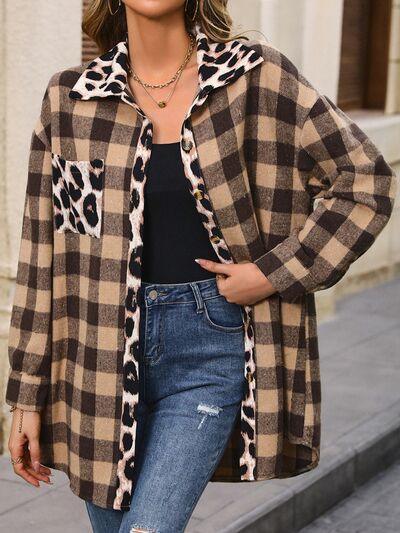 a woman standing on a sidewalk wearing a leopard print coat