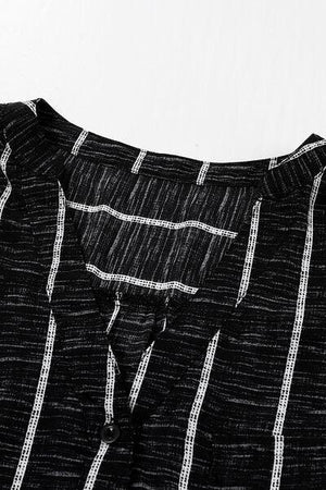 a close up of a black and white striped shirt