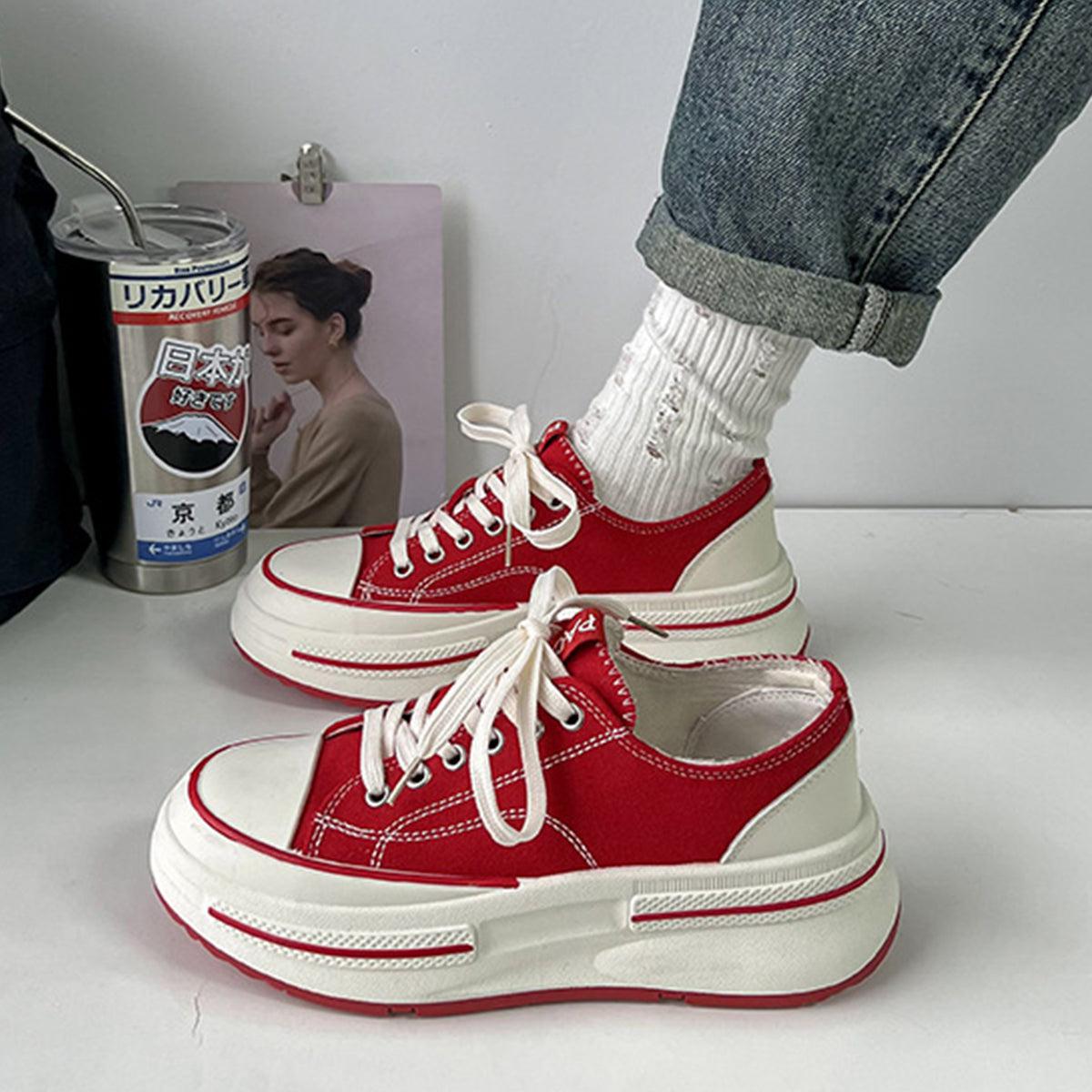 a pair of red and white shoes with white socks