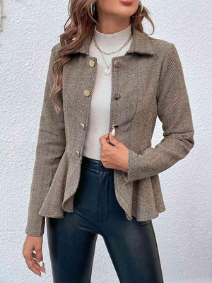 a woman wearing a brown jacket and black pants