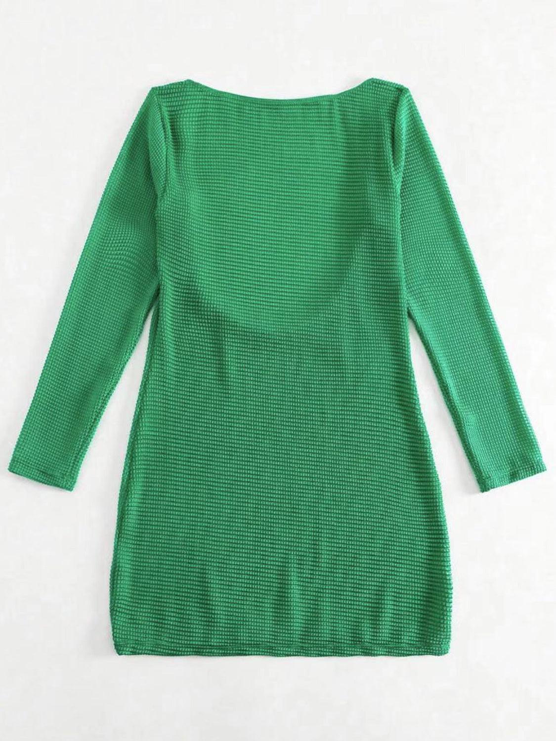 a green sweater dress on a white background