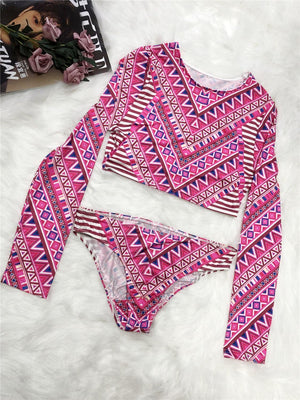 a bikini top and bottom with a pink and white pattern