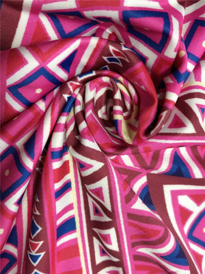 a close up of a pink and blue scarf