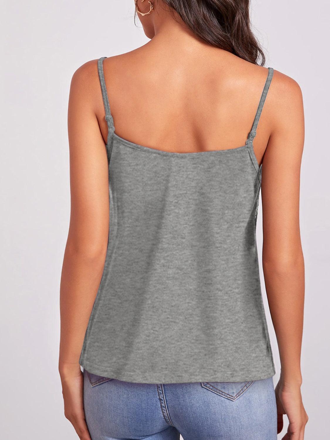 a woman wearing a grey tank top