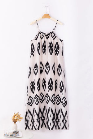 a white and black dress hanging on a hanger