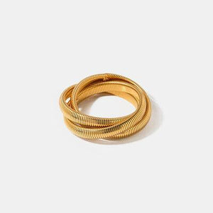 a gold ring on a white background