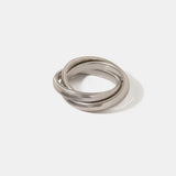 a pair of silver rings on a white background