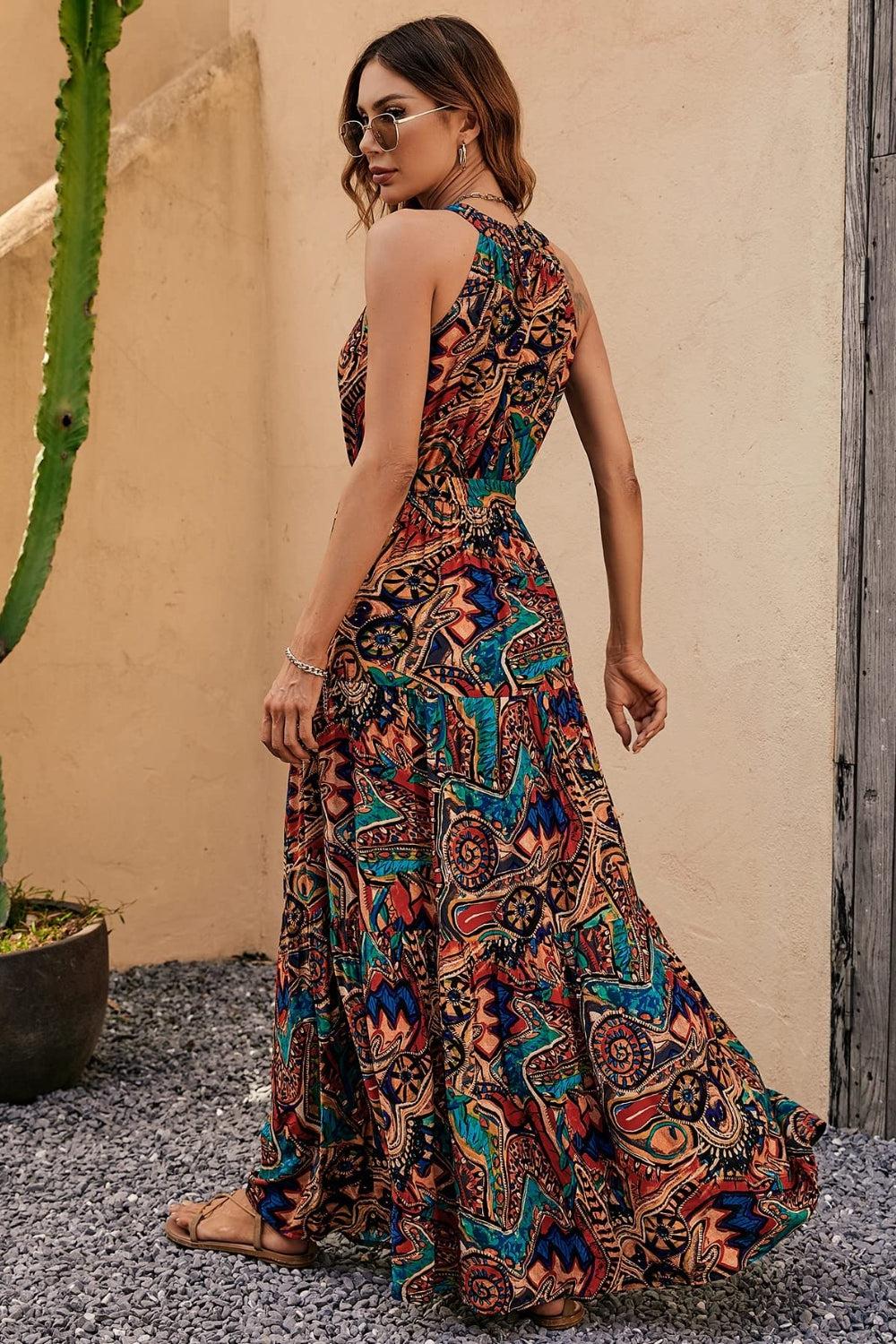 a woman in a long dress standing next to a cactus