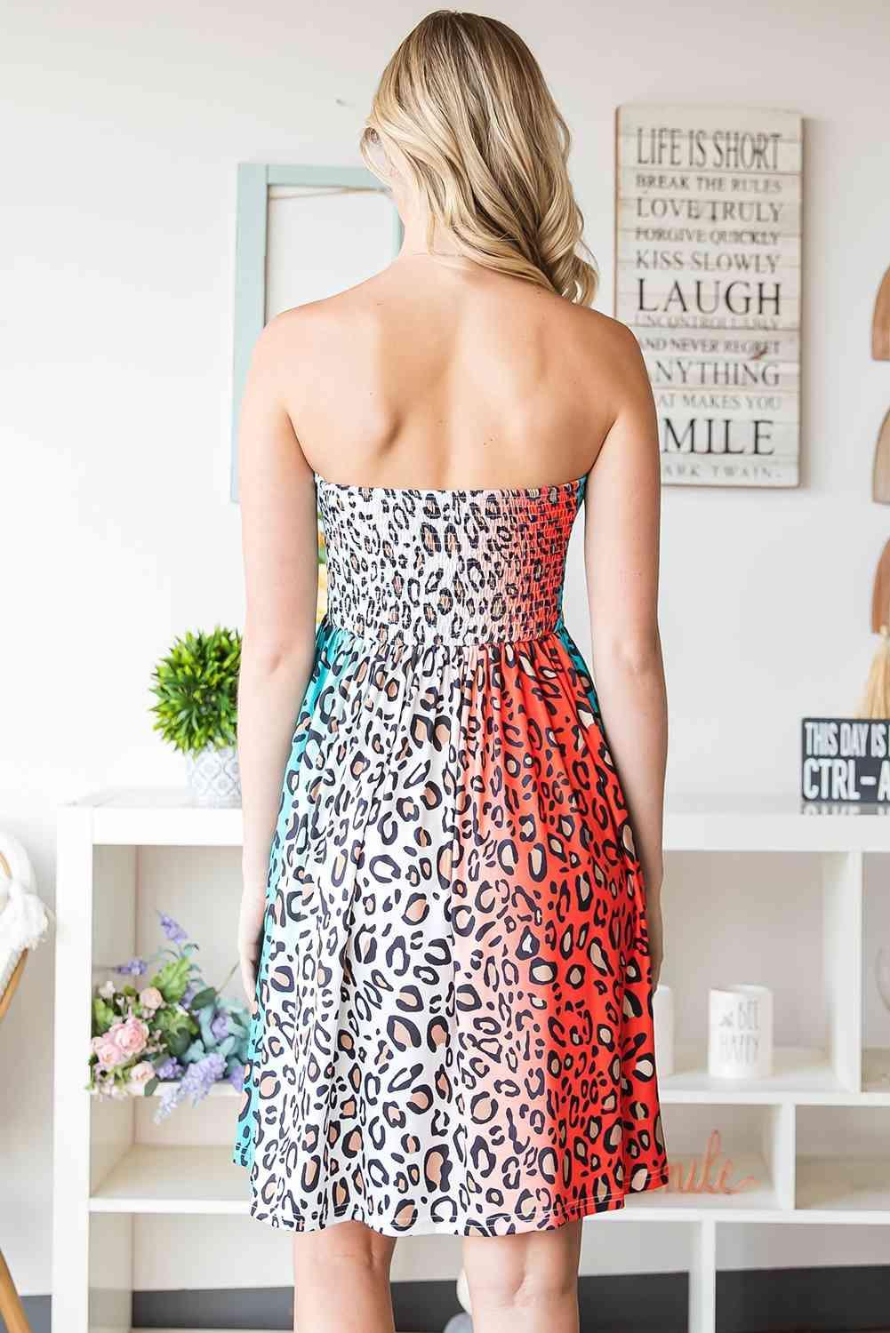 a woman in a leopard print dress