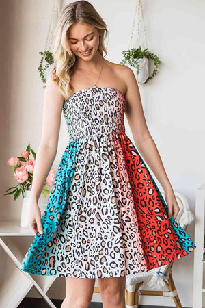 a woman in a leopard print dress