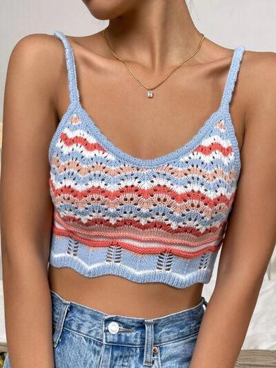 a woman wearing a blue and red striped crop top