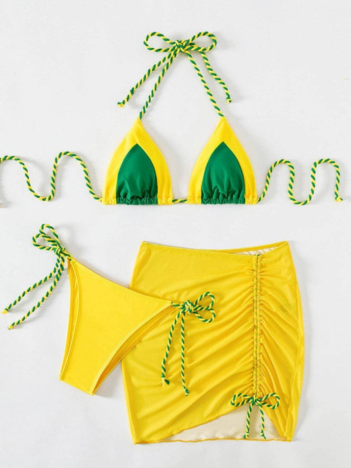 a yellow bikini with green straps and a green bikini top