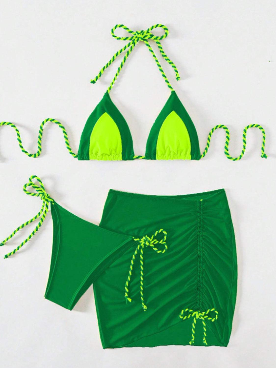 a bikini top and skirt with a green bikini bottom
