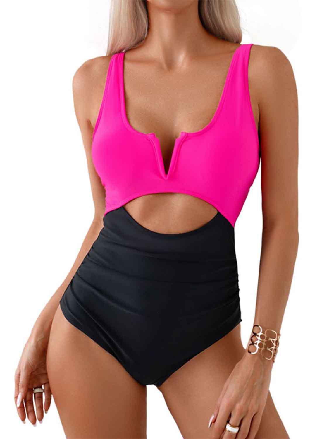 a woman in a pink and black swimsuit