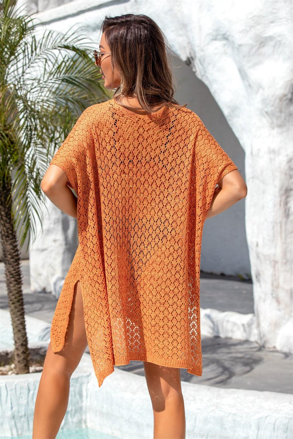 a woman in an orange knitted dress standing next to a pool